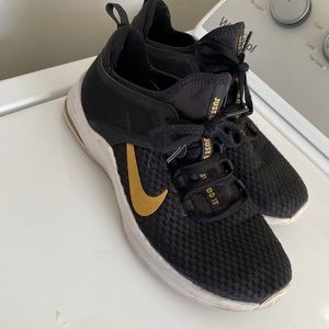 black & gold NIKE sneakers